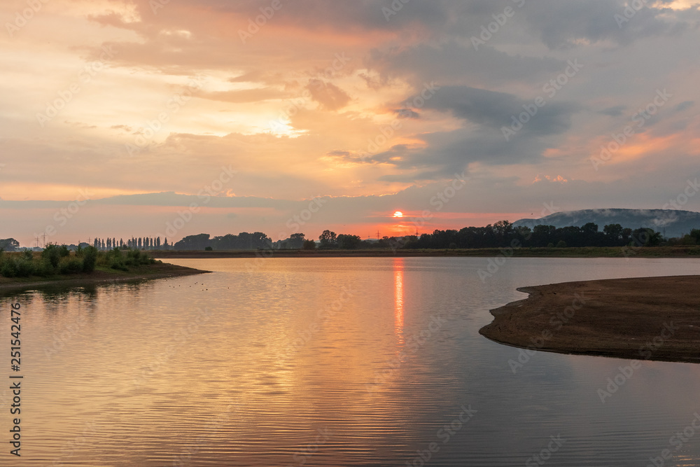 Naklejka premium Sunset on a lake in Hohenrode in Germany