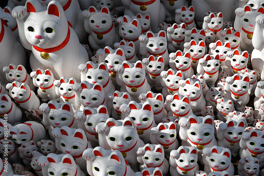 statues of cats in the Gotokuji temple in Japan.