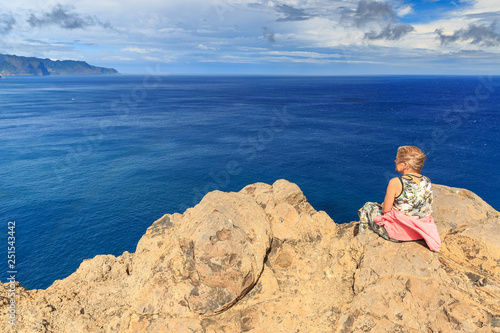 Tourist on the cliffs in the beautiful landscape of the east coast of the island Madeira at Ponta de Sao Lourenco nature reserve