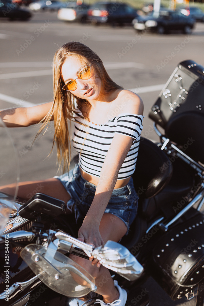 Sport beuatiful sexy caucasian young hipster gorgeous girl on motorbike. Sport, fashion, gorgeous model concept Sport beuatiful sexy caucasian young hipster gorgeous girl on motorbike. Sport, fashion, gorgeous model concept