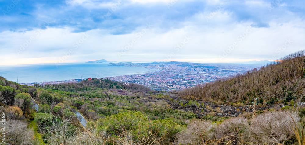 View from active volcano Vesuvius on the Gulf and Naples city in evening, Italy