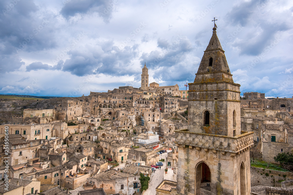 Matera, Basilicata, Italy, landscape at day of the old town (sassi di Matera), European Capital of Culture. Church San Pietro Barisano and duomo cathedral. Unseco World Heritage site