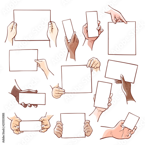 Human hands holding blank paper sheets of different size