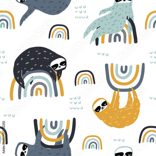 Fotografie Seamless childish pattern with funny sloths on rainbows