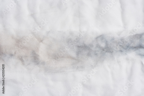 White and gray wrinkled silk. Air folds. Silk fabric texture for background or design element. Thin tissue.