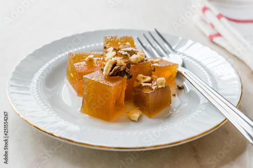 Turkish Crispy Pumpkin Dessert from Hatay / Kirecte Kabak Tatlisi with Walnut Powder. photo