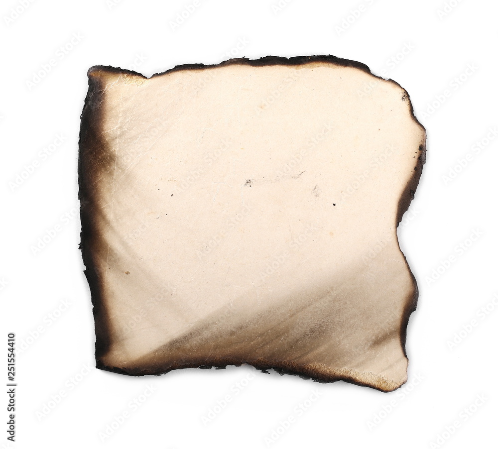 Burned and charred paper scrap isolated on white background, top view Burned and charred paper scrap isolated on white background, top view
