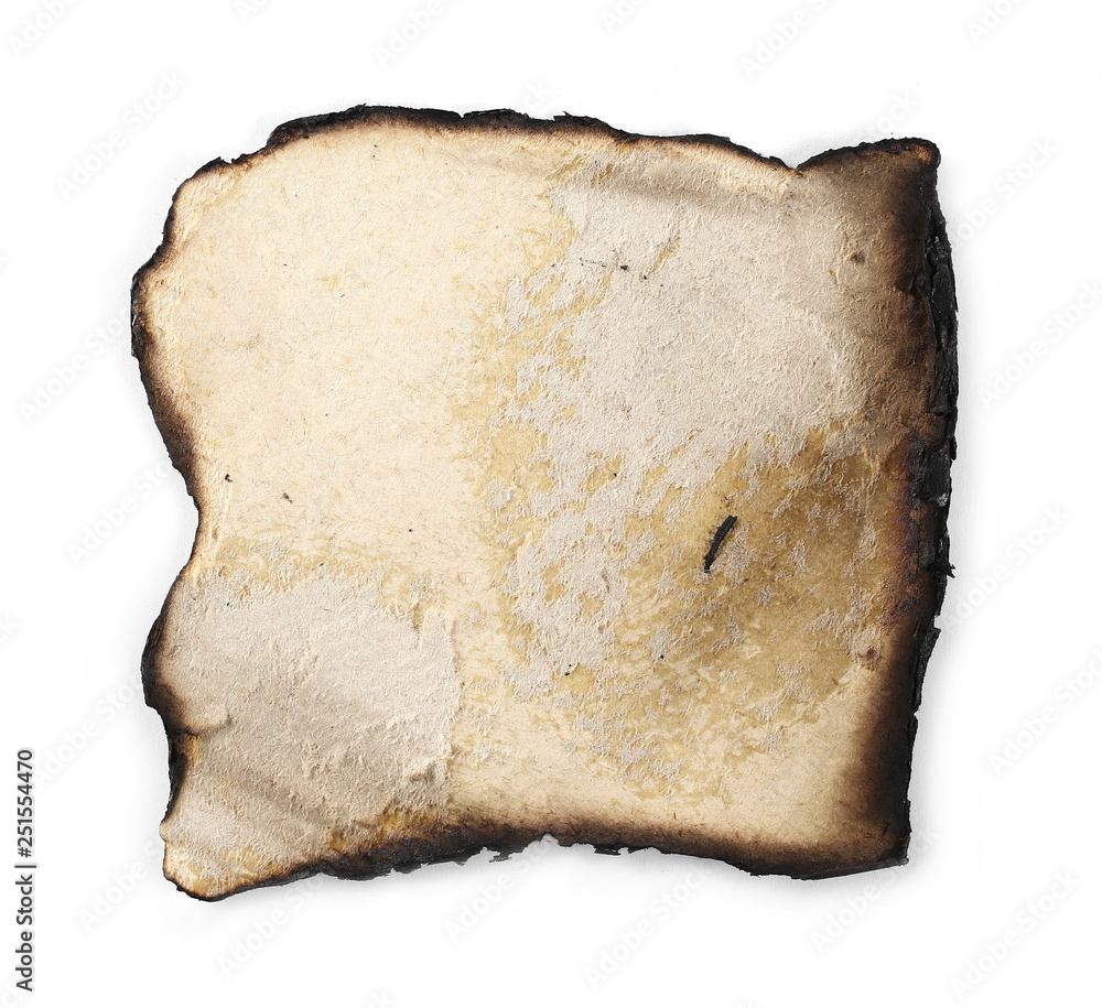 Burned and charred paper scrap isolated on white background, top view Burned and charred paper scrap isolated on white background, top view