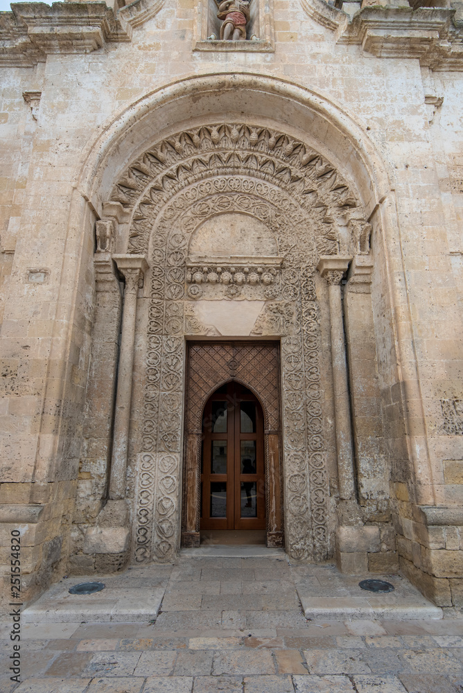 Entrance door of The Romanesque Parrocchia di San Giovanni Battista Parish church (chiesa). Saint John the Baptist in Matera, Basilicata, Italy. UNESCO World Heritage Site and capital culture