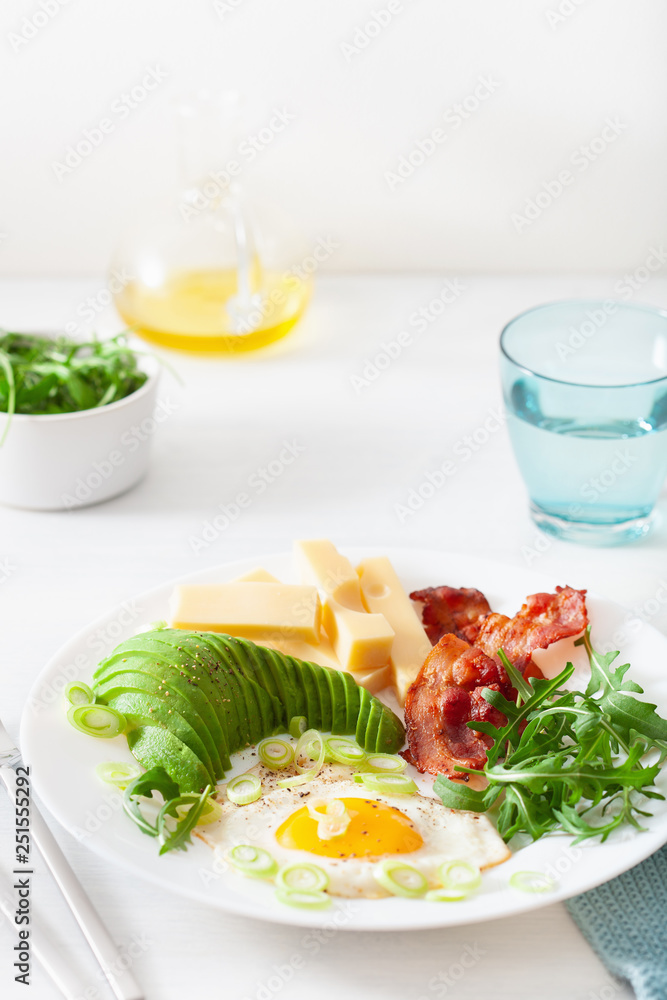 healthy keto breakfast: egg, avocado, cheese, bacon healthy keto breakfast: egg, avocado, cheese, bacon