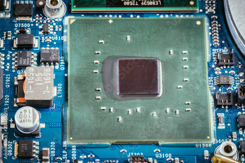 Computer Technology: Close up of a computer chip on a circuit board photo