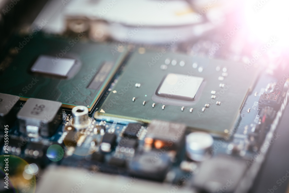 Computer Technology: Close up of a computer chip on a circuit board. Light effect. Computer Technology: Close up of a computer chip on a circuit board. Light effect.