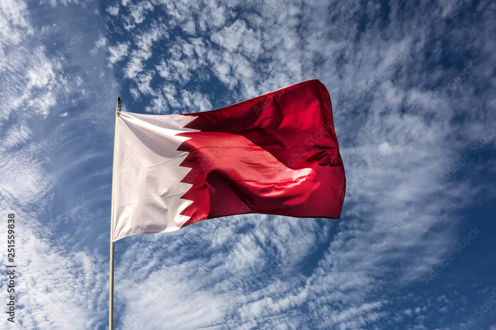 Naklejka premium Flag of the country Qatar waving in the wind