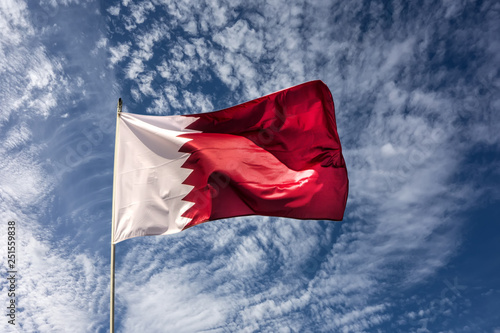 Flag of the country Qatar waving in the wind