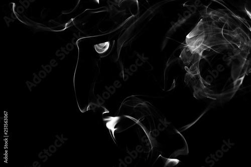 Smoke in the shape of the head men photo