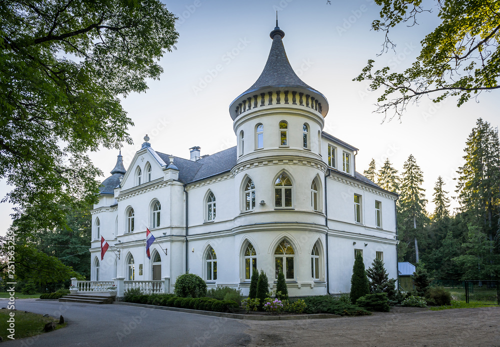 The White Castle is one of Baldone's most beautiful buildings. Latvia. Next to the castle is a fountain and a park.