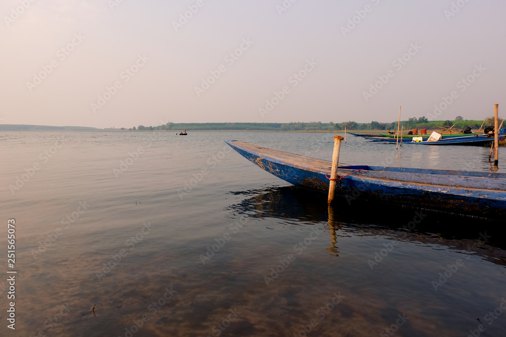 Fototapeta premium boat on the beach at sunset