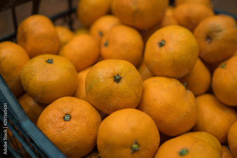 Delicious juicy orange tangerines in the box Delicious juicy orange tangerines in the box
