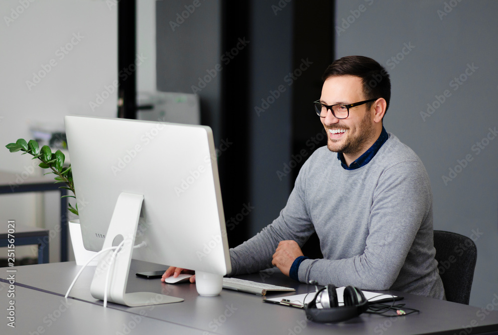 Young enthusiastic entrepreneur who loves his job Young enthusiastic entrepreneur who loves his job