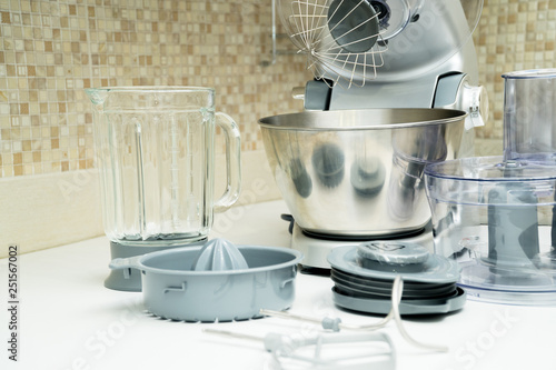 disassembled multifunctional food processor on kitchen countertops