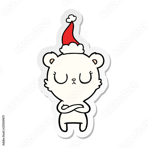 peaceful sticker cartoon of a polar bear wearing santa hat