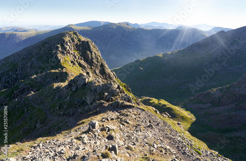 Sunrise over Ennerdale from Scoat Fell with views of Steeple In the English Lake District, UK. photo