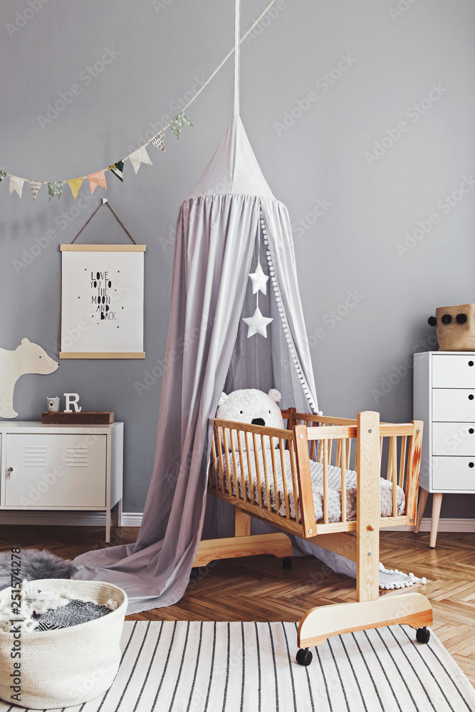 Stylish and cute scandinavian decor of newborn baby room with mock