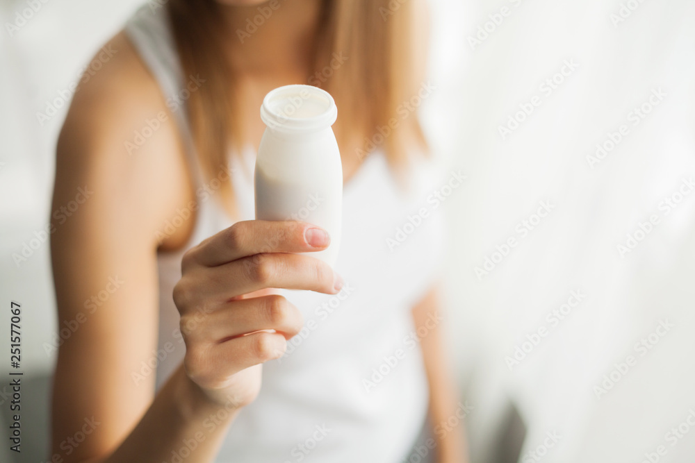 Healthy Breakfast. Young woman at home eating yogurt Healthy Breakfast. Young woman at home eating yogurt