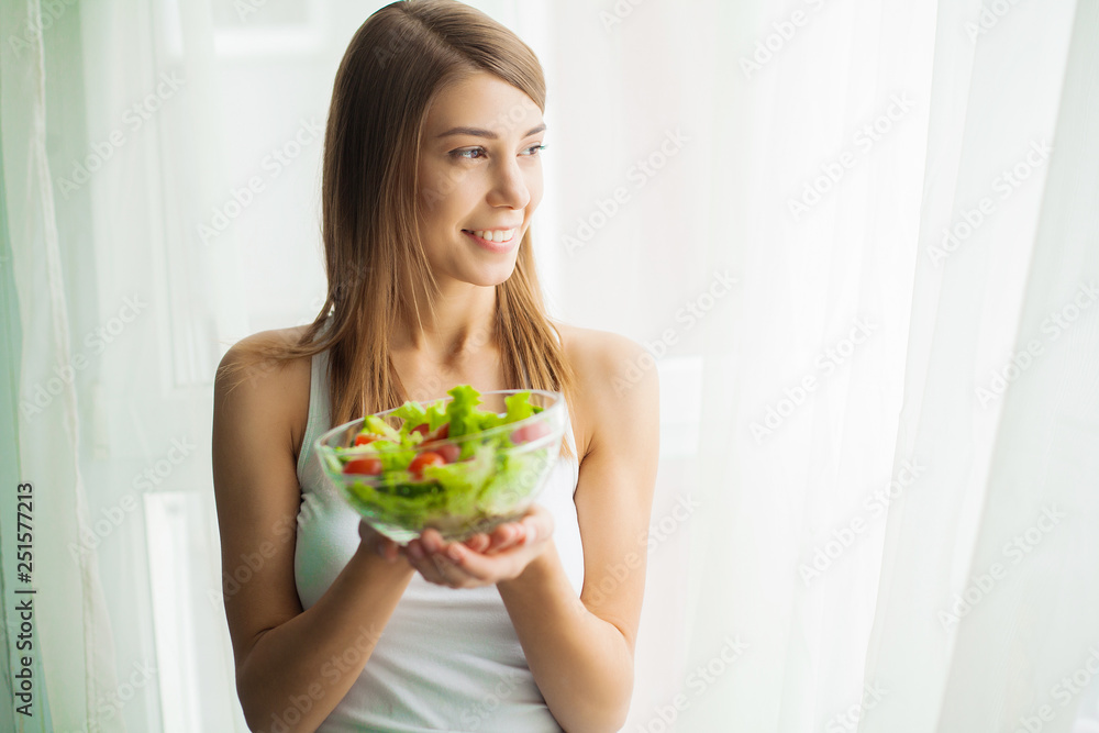 Diet and Healthy eating. Young woman eating healthy salad after workout Diet and Healthy eating. Young woman eating healthy salad after workout