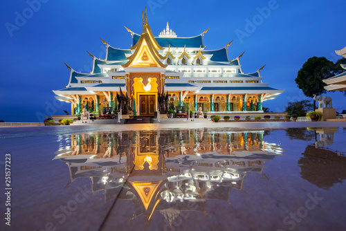 Thai temple beautiful at night twilight blue sky and light reflect on floor