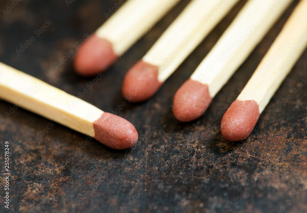 Smoking concept, matches close-up on grunge metal background