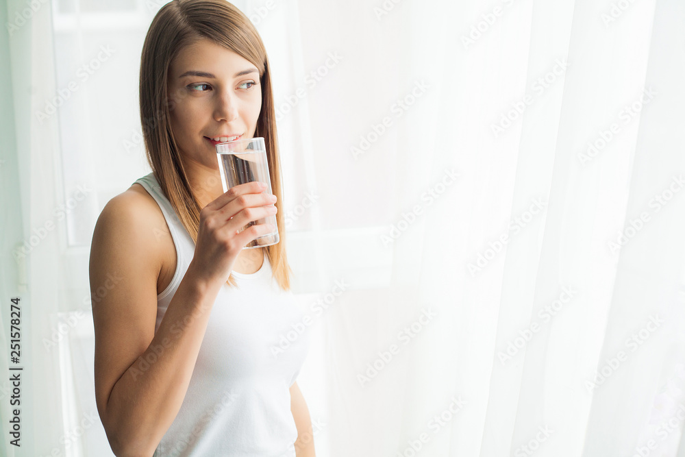 Young woman drinking water. Drinking fresh water Young woman drinking water. Drinking fresh water