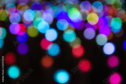 Colorful blur bokeh fairy street light festival, night defocused & dark background.
