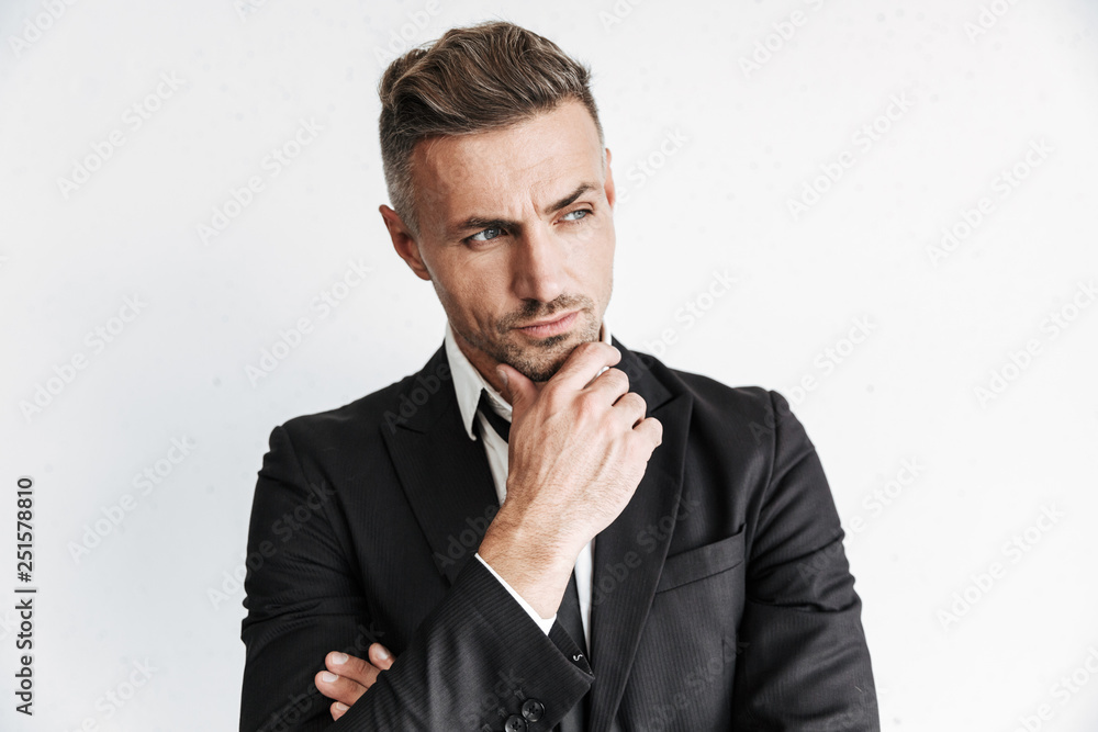 Handsome business man posing isolated over white wall background. Handsome business man posing isolated over white wall background.
