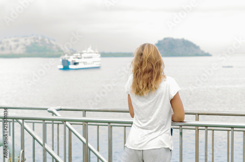 Anonymous girl traveling by sea. Enjoy voyage in the Indian ocean. Summer cruise. Happy time for a female traveler.