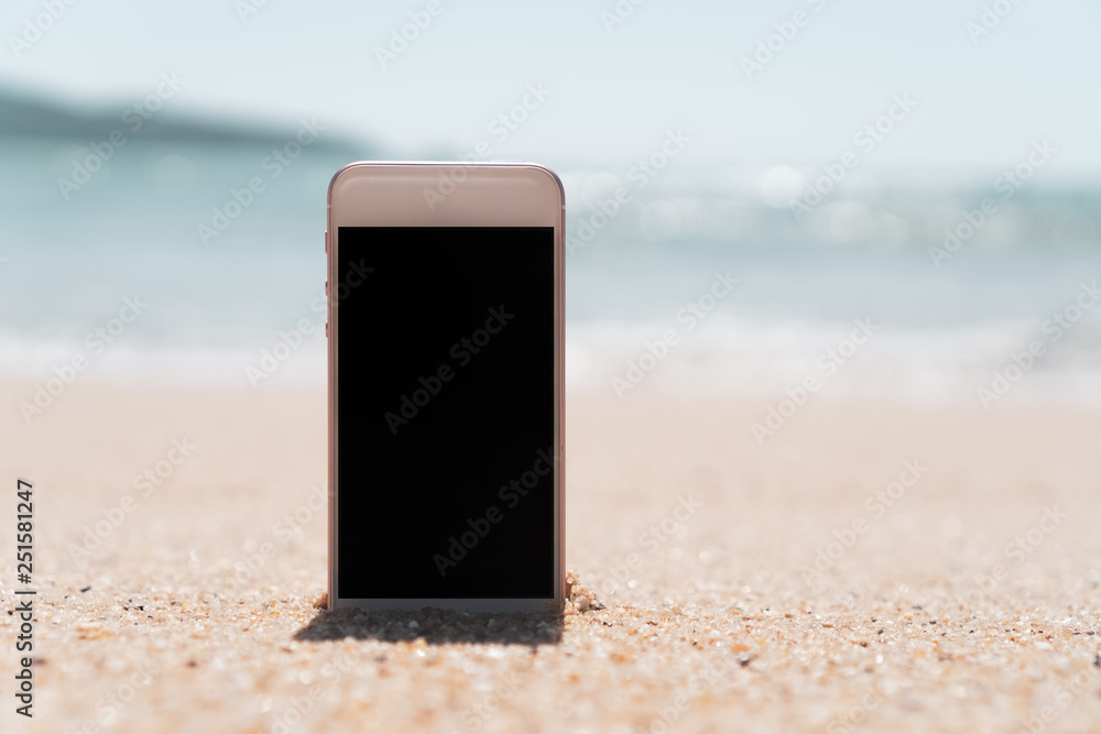 Smart phone on sand beach texture background. Smart phone on sand beach texture background.