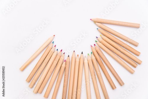 set of colored pencils on a white background