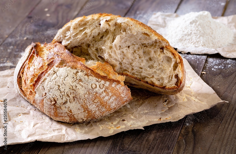 Rustic homemade bread on a wooden background