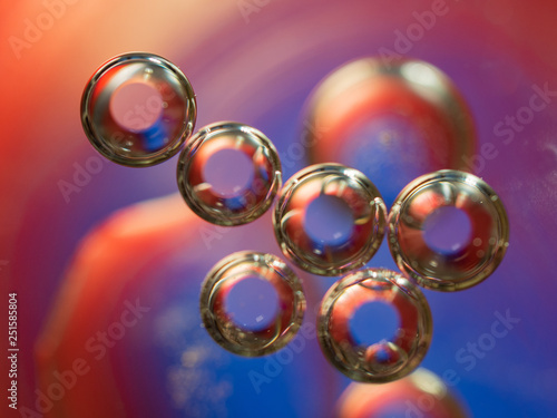 Spheres making an abstract geometric figure. Close up shot. Blurred background. Selective soft focus. Glittering spheres, an abstract background. Multicolour geometrical universe. Macro shot