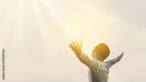  Copy space of happy man raise hands on sky white cloud with sun light abstract background.
