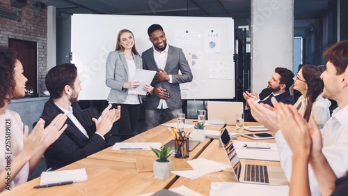Boss welcoming new employee and representing to colleagues