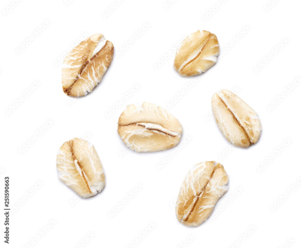 Oat-flakes isolated on white background. Close up. Oat-flakes isolated on white background. Close up.