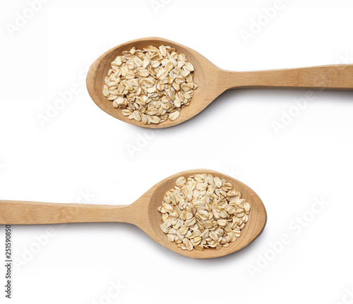 Wooden spoon with oat-flakes cut out. Top view.