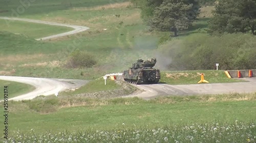 Bradley fighting vehicle firing main gun 3 photo