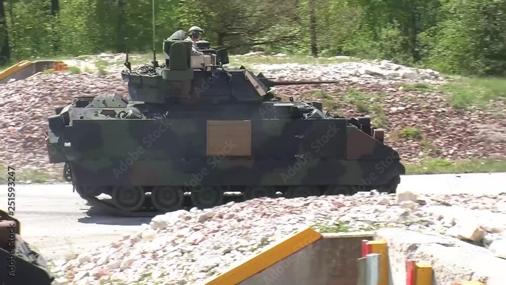 Bradley fighting vehicle passing by Bradley fighting vehicle passing by