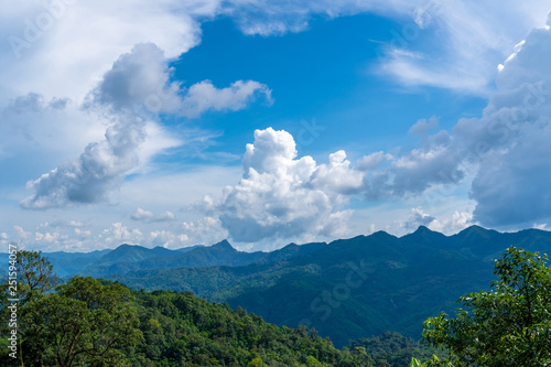 Blue sky high peak mountains fog hills mist scenery river lake dam bay gulf wildlife National park views Kanchanaburi, Thailand.