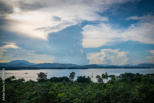 Blue sky high peak mountains fog hills mist scenery river lake dam bay gulf wildlife National park views Kanchanaburi, Thailand.