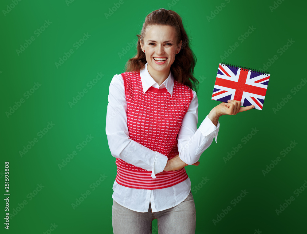 happy student showing United Kingdom flag coloured notebook happy student showing United Kingdom flag coloured notebook