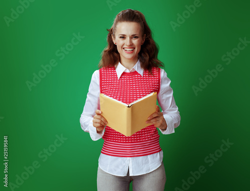 learner woman with opened book isolated on chalkboard green © Alliance