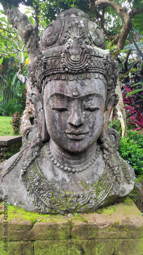 Buddha image in the tropical garden in Bali